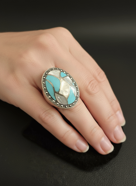Beautiful oval, genuine, turquoise, and mother of pearl ring set in sterling silver