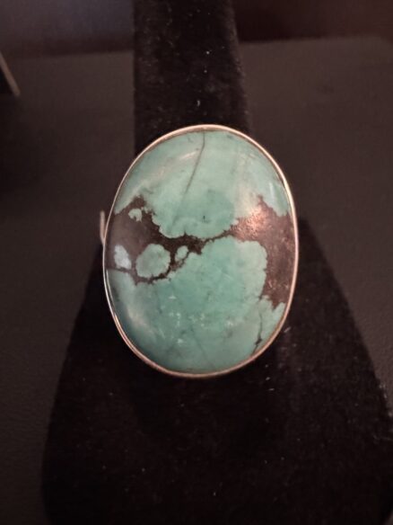 Oval, genuine, turquoise stone set in sterling silver setting