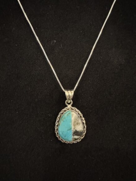 Unusual turquoise and white buffalo turquoise pendant in intricate sterling silver setting