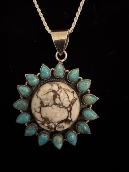 Beautiful white, buffalo and blue turquoise pendant with a sterling silver chain