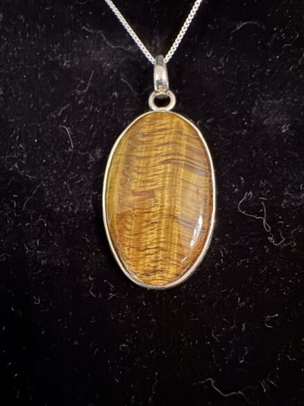 Oval Tiger’s eye Stone set in Sterling silver pendant with