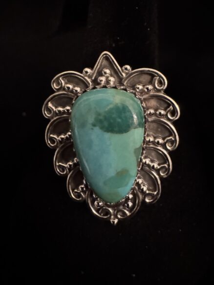 Pear shaped, beautiful turquoise set in intricate sterling silver