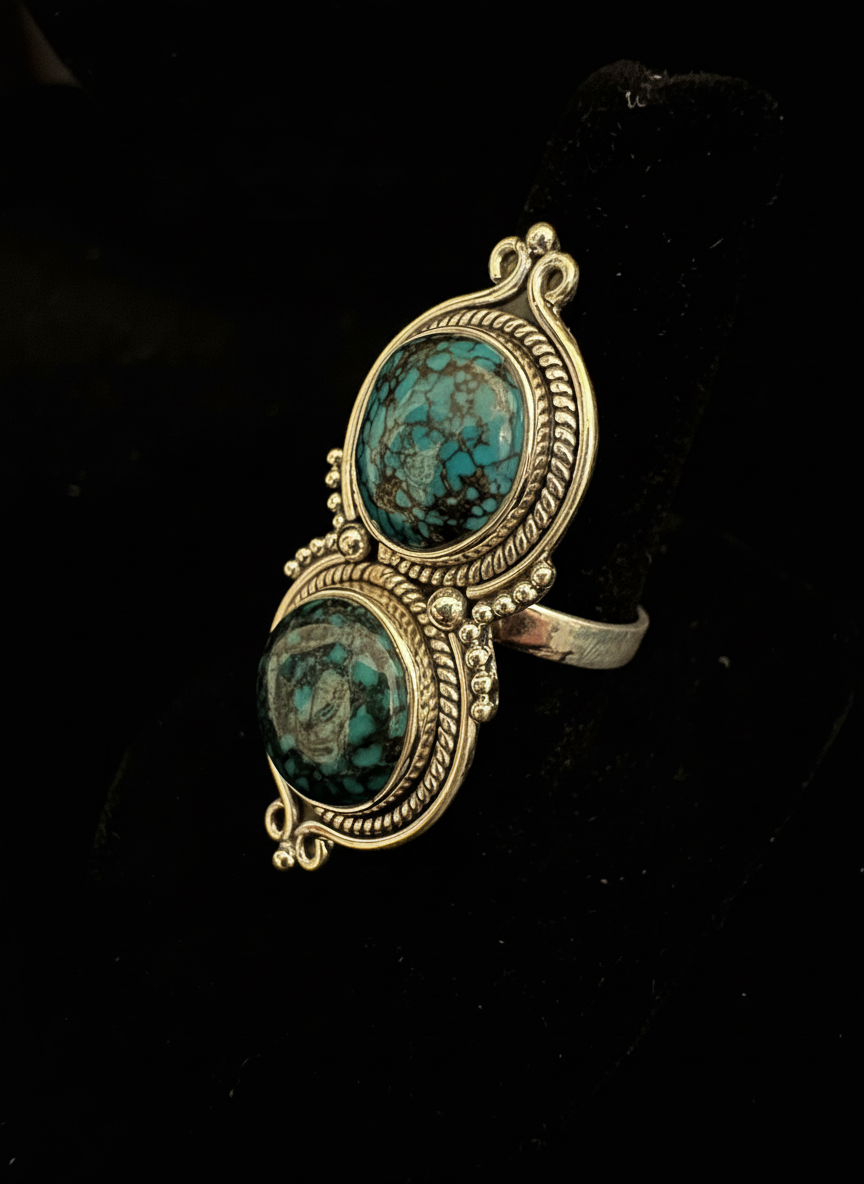 Tibetan turquoise two stone ring set in intricate sterling silver